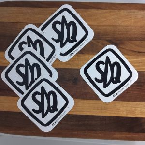 the SDQ sticker in a nice layout on a cutting board